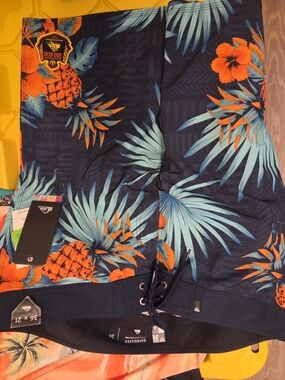 Quiksilver Eddie Aikau Tropical Pineapple Boardshorts in Navy & Orange